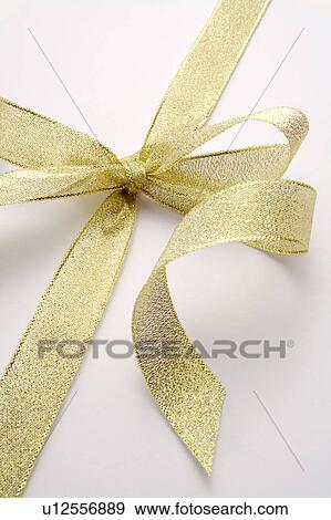 Stock Photo - Close-up of a golden tied knot. Fotosearch