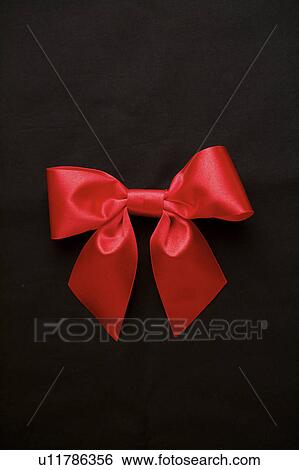 Close-up of a red bowknot View Large Photo Image Stock Photograph - Close-up of a red bowknot. Fotosearch