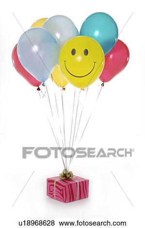 Close-up of a wrapped present with multi-colored balloons View Large Photo Image Stock Photo - Close-up of a wrapped present with multi-colored balloons. Fotosearch