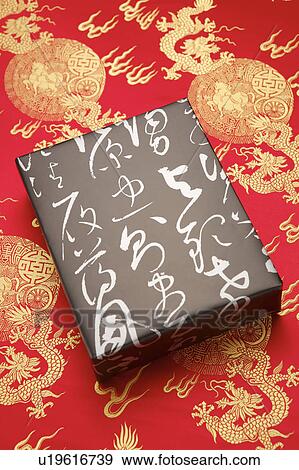 Stock Photo - Close-up of a wrapped present with lucky patterns. Fotosearch