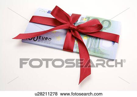 Stock Photo - Close-up of paper money with a tied ribbon. Fotosearch