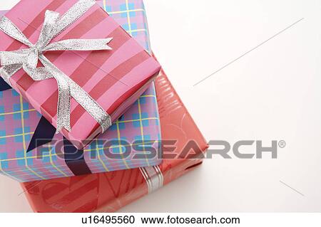 Close-up of three wrapped presents View Large Photo Image Stock Image - Close-up of three wrapped presents. Fotosearch
