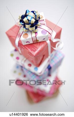 Stock Photograph - Close-up of wrapped gifts in a stack. Fotosearch
