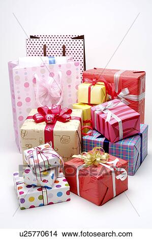 Picture - Close-up of wrapped presents and shopping bags. Fotosearch