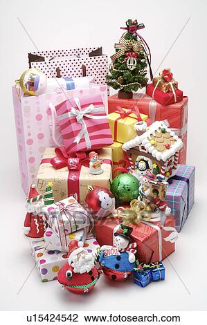 Stock Image - Close-up of wrapped presents and decorations for Christmas. Fotosearch