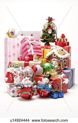 Stack of presents and Christmas decorations View Large Photo Image Picture - Stack of presents and Christmas decorations. Fotosearch