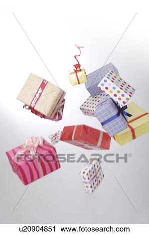 Stock Image - Wrapped gifts in the mid-air. Fotosearch