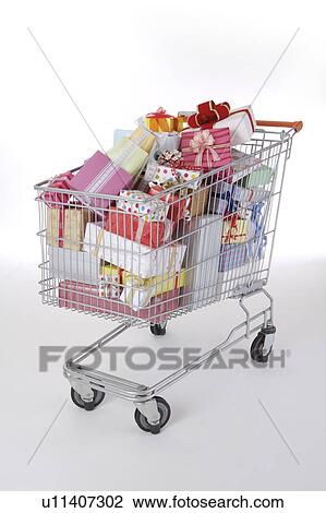 Stock Image - Wrapped gifts in the shopping cart. Fotosearch