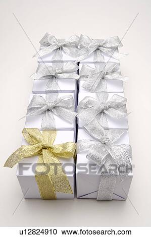 Wrapped gifts with ribbons in a row View Large Photo Image Stock Image - Wrapped gifts with ribbons in a row. Fotosearch
