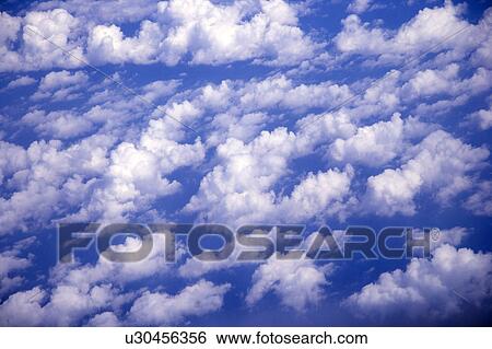 Stock Photograph - Cirrus in the clear sky. Fotosearch
