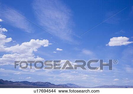 Picture - Clouds in the clear sky. Fotosearch