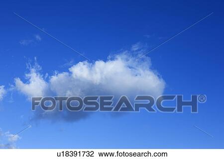 Stock Image - Clouds in the clear sky. Fotosearch