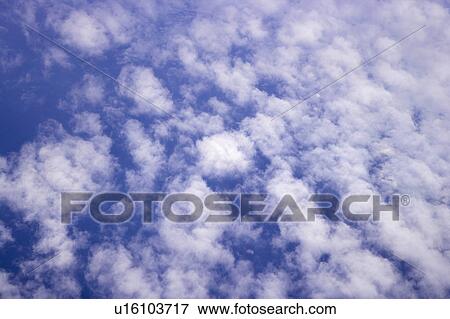 Clouds in the clear sky View Large Photo Image Stock Photo - Clouds in the clear sky. Fotosearch