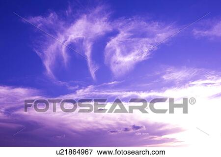 Stock Photo - Clouds in the clear sky. Fotosearch