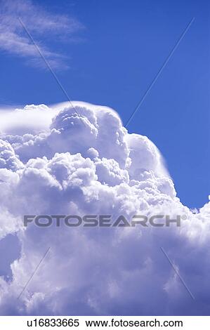 Stock Photography - Clouds in the clear sky. Fotosearch