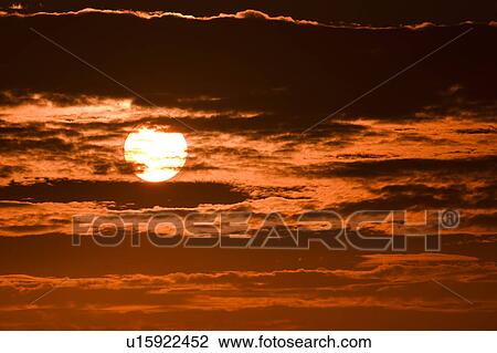 Stock Image - Pink clouds at sunrise. Fotosearch