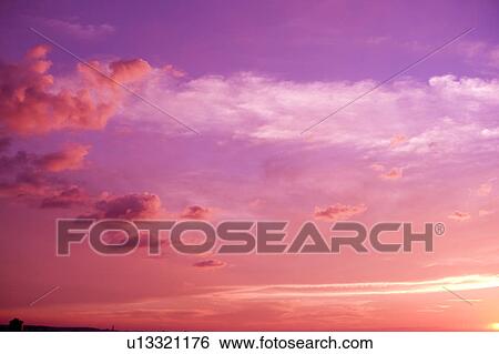 Pink clouds in the clear sky View Large Photo Image Stock Photograph - Pink clouds in the clear sky. Fotosearch
