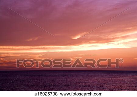Stock Photo - Pink clouds in the sky. Fotosearch