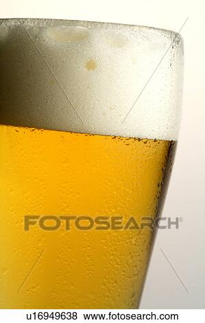 Close-up of a glass of beer with bubbles View Large Photo Image Stock Photo - Close-up of a glass of beer with bubbles. Fotosearch