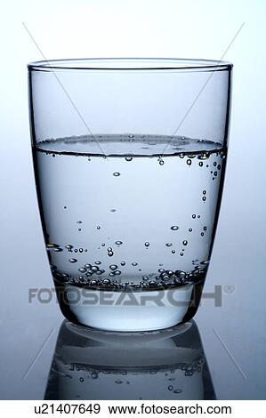 Stock Photo - Close-up of a glass of water with air bubbles. Fotosearch