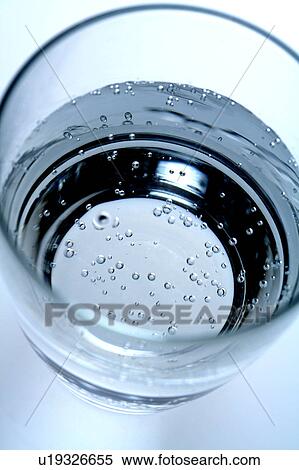 Close-up of a glass of water with air bubbles View Large Photo Image Stock Photography - Close-up of a glass of water with air bubbles. Fotosearch