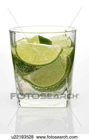 Stock Photo - Close-up of a glass of water with lemons. Fotosearch