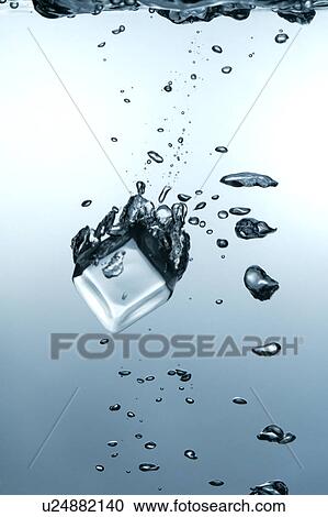 Close-up of an ice cube falling into water View Large Photo Image Stock Image - Close-up of an ice cube falling into water. Fotosearch