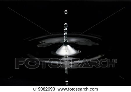 Drops falling into the water View Large Photo Image Stock Image - Drops falling into the water. Fotosearch