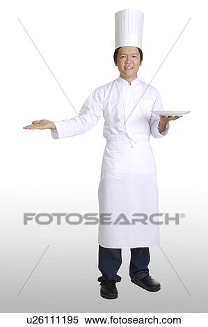 Chef holding a plate on one hand and reaching the other hand out View Large Photo Image Stock Photography - Chef holding a plate on one hand and reaching the other hand out. Fotosearch