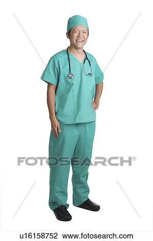 Stock Image - Man wearing the operating gown and looking at the camera. Fotosearch