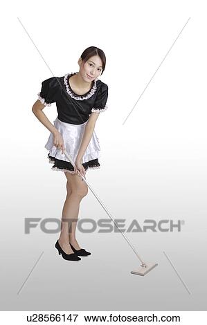 Young maid cleaning the floor with the mop View Large Photo Image Stock Photo - Young maid cleaning the floor with the mop. Fotosearch