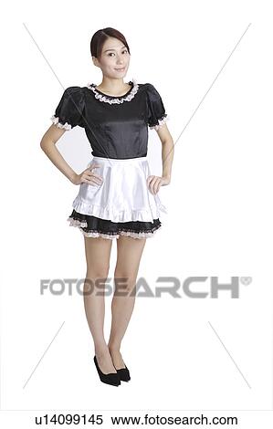 Young woman wearing the clothes of maid, arms akimbo View Large Photo Image Stock Photography - Young woman wearing the clothes of maid, arms akimbo. Fotosearch
