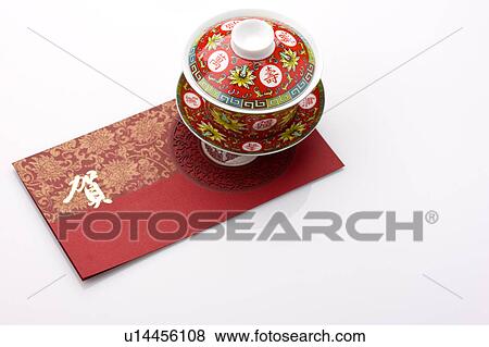 Stock Photo - Close-up of a tea cup on a Chinese New Year card. Fotosearch