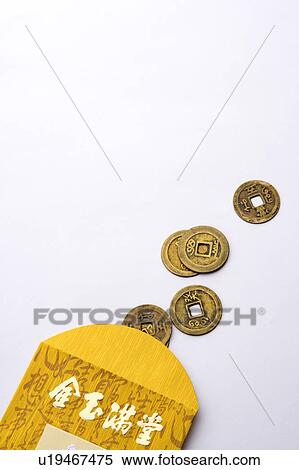 Stock Photography - Close-up of Chinese coin with paper bag. Fotosearch