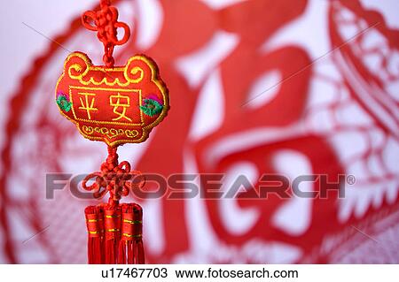 Stock Image - Close-up of Chinese decoration with decoupage in background. Fotosearch