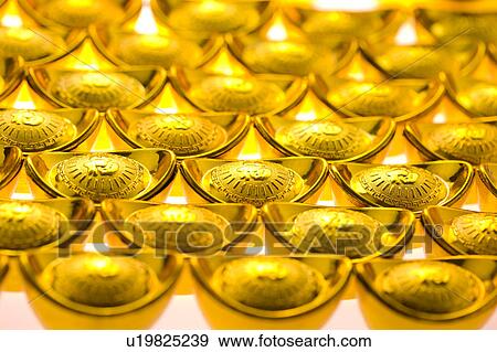 Stock Photo - Close-up of gold ingots in a row, full frame. Fotosearch