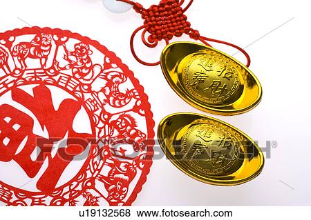 Close-up of two gold ingots, hanging decoration and decoupage View Large Photo Image Stock Photo - Close-up of two gold ingots, hanging decoration and decoupage. Fotosearch