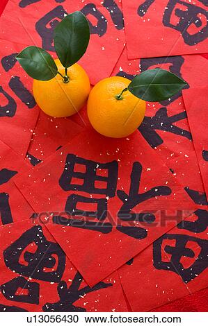 Close-up of two oranges on Chinese scripts View Large Photo Image Stock Image - Close-up of two oranges on Chinese scripts. Fotosearch