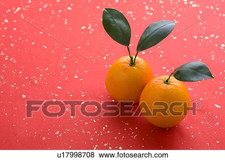 Stock Photo - Close-up of two oranges on paper background. Fotosearch