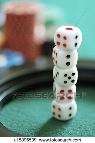 Stock Photo - Close-up of five dice one on top of the other. Fotosearch