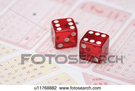 Stock Image - Dice on lottery ticket. Fotosearch