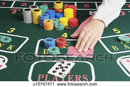 Stock Image - Female croupier. Fotosearch