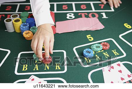 Stock Image - Female croupier. Fotosearch