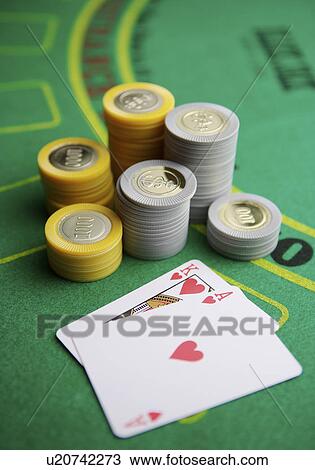 Stock Image - Gambling chips on betting mat. Fotosearch