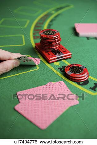 Man playing poker, looking at cards, close-up, rear view View Large Photo Image Stock Photograph - Man playing poker, looking at cards, close-up, rear view. Fotosearch