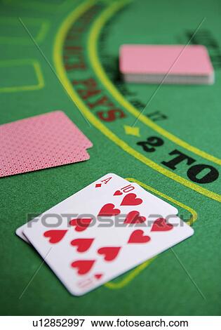 Stock Photo - Poker on betting mat. Fotosearch