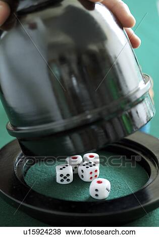 Woman lifting up a dice box, close-up View Large Photo Image Stock Photo - Woman lifting up a dice box, close-up. Fotosearch