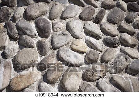Irregular rocks set into cemnet wall View Large Photo Image Picture - Irregular rocks set into cemnet wall. Fotosearch