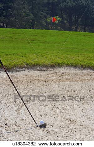 Close-up of a golf club and a golf ball in sand trap View Large Photo Image Stock Image - Close-up of a golf club and a golf ball in sand trap. Fotosearch