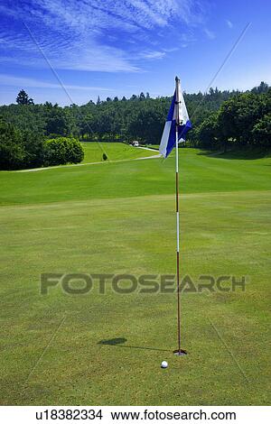 Flag on putting green View Large Photo Image Picture - Flag on putting green. Fotosearch